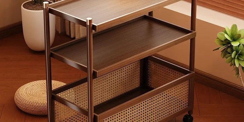 Salon rolling cart and side table next to a lash bed